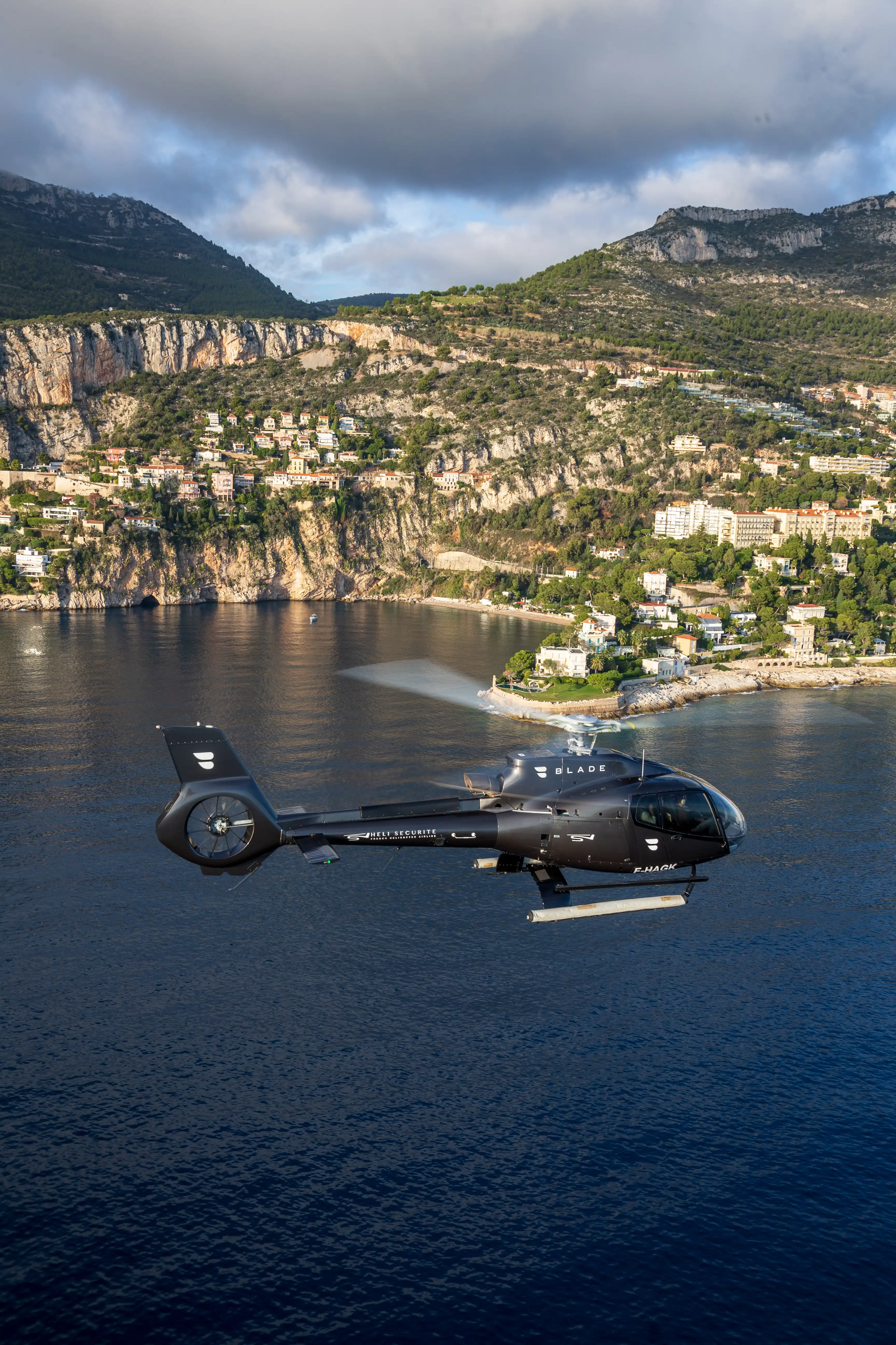 MONACAIR helicopter in flight over the French Riviera between Nice and Monaco